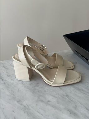 D’amelio cream heel sandals with round buckle ankle strap